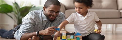 Dad and son playing blocks